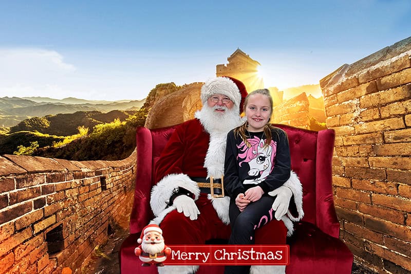 A participant "joins" Santa on the Great Wall of China at the Cleveland Green Screen Photo Booths Christmas Around the World Photo Experience.